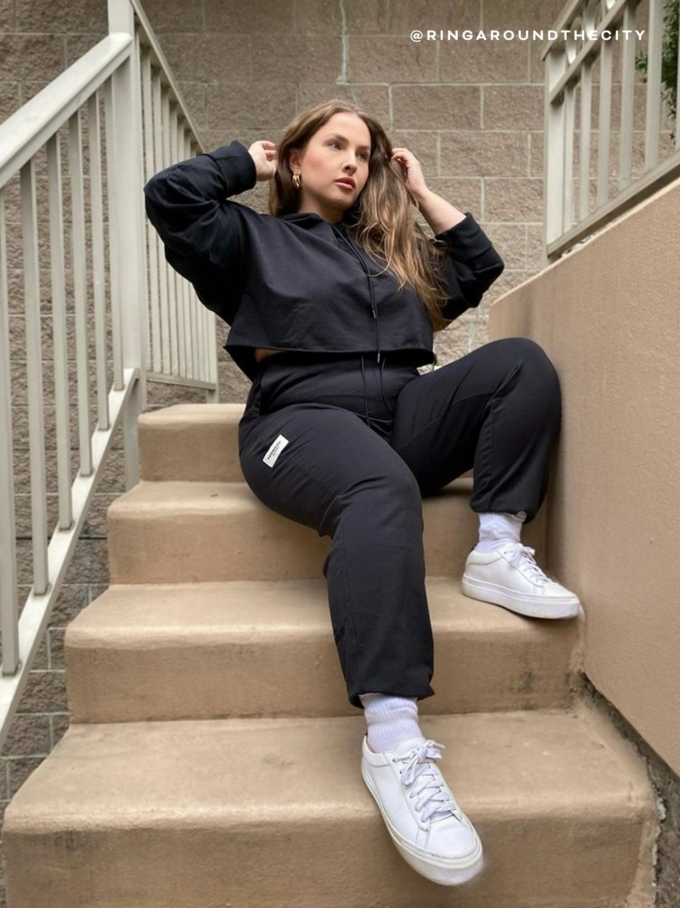 black cropped hoodie with brand logo and jogger sweatpant