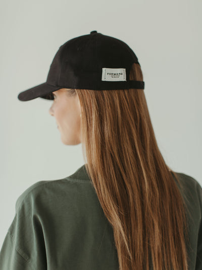 monochrome black ball cap and crewneck sweatshirt