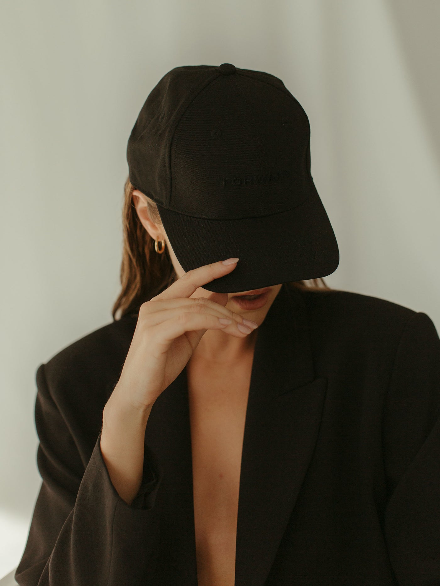 monochrome black ball cap and blazer