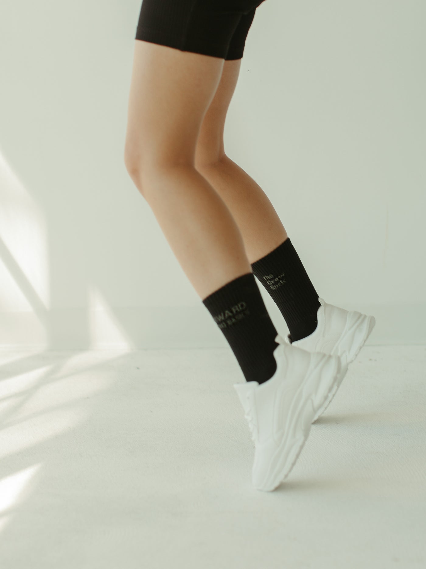 black crew socks with woven brand logo 