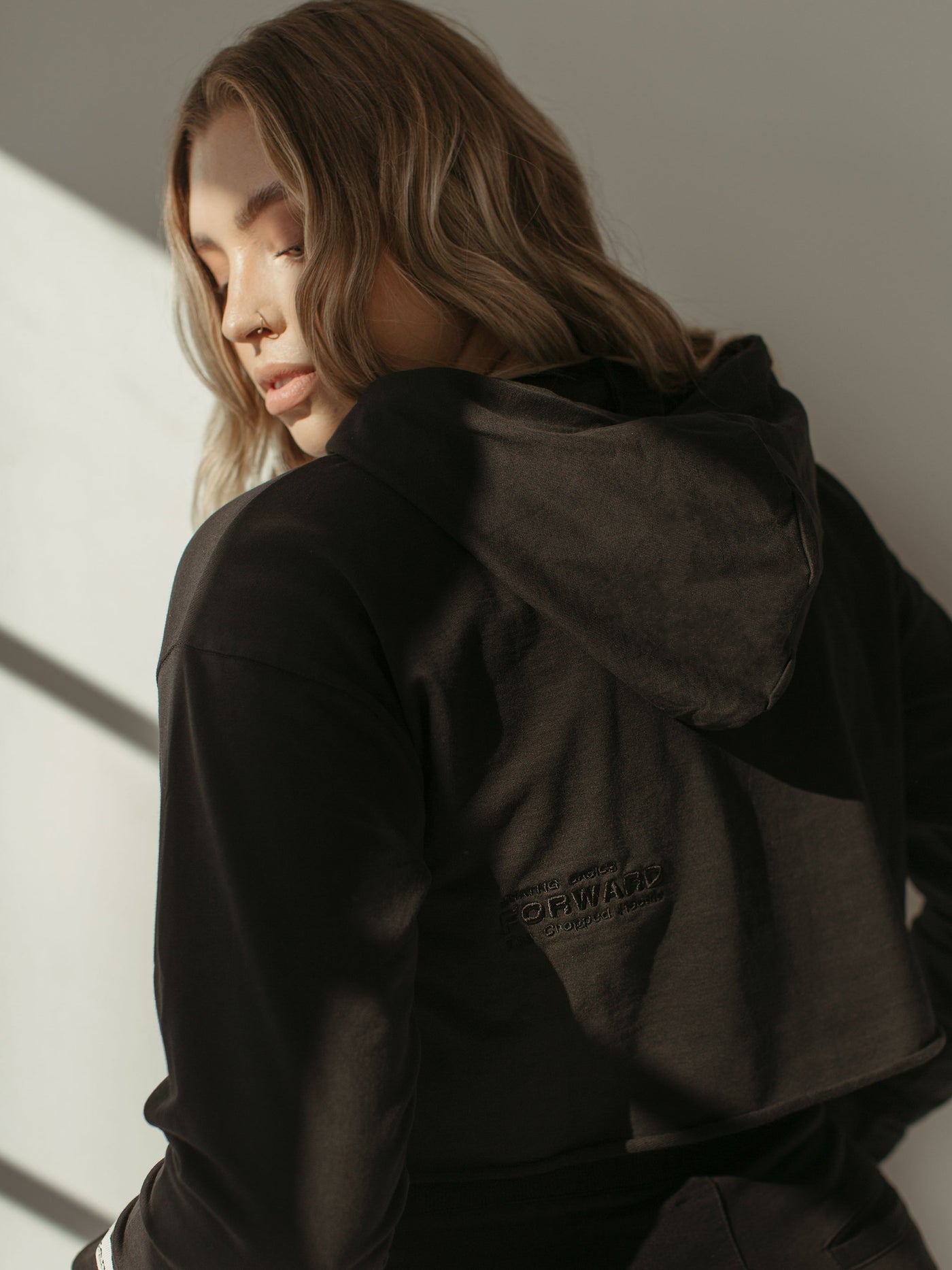 black cropped hoodie with brand logo and embroidery
