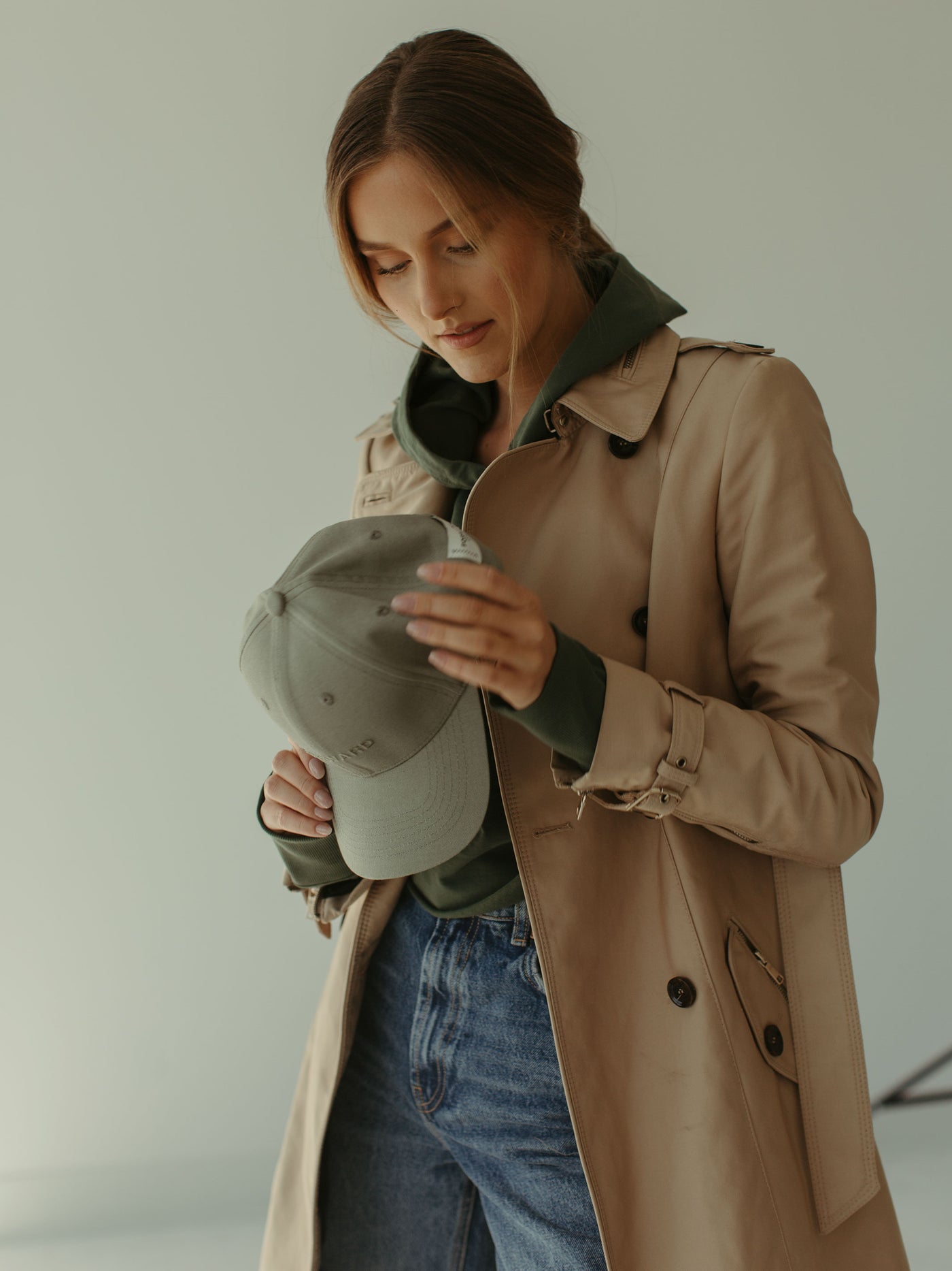 monochrome sage ball cap and cropped hoodie and trenchcoat