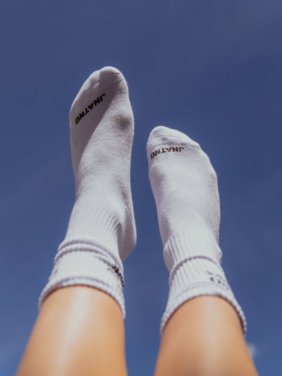 white crew socks with woven logo